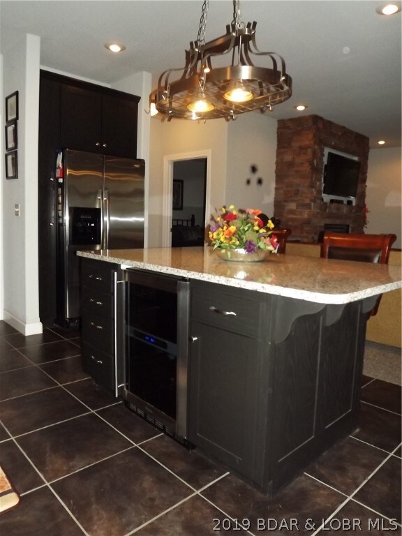 Oversized island contains a built in wine cooler!