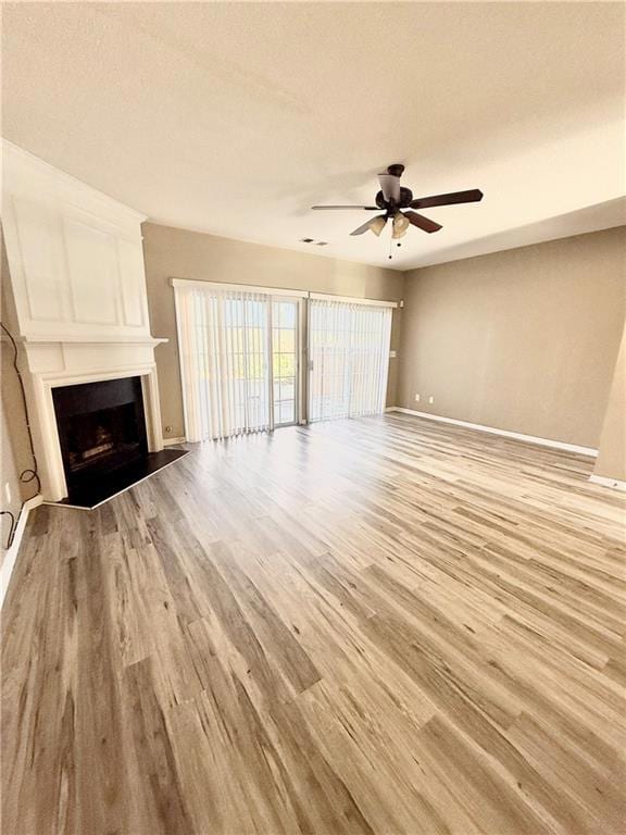 Unfurnished living room featuring light wood-style