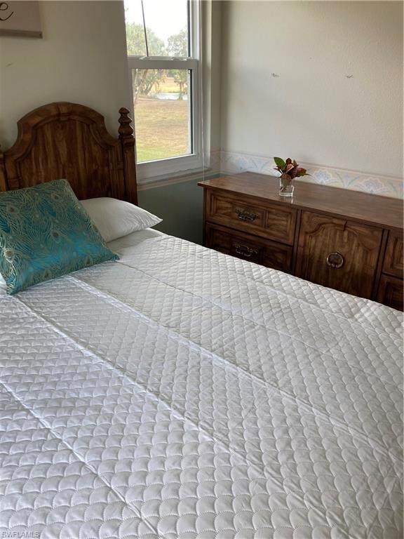 Second bedroom with view of the pond