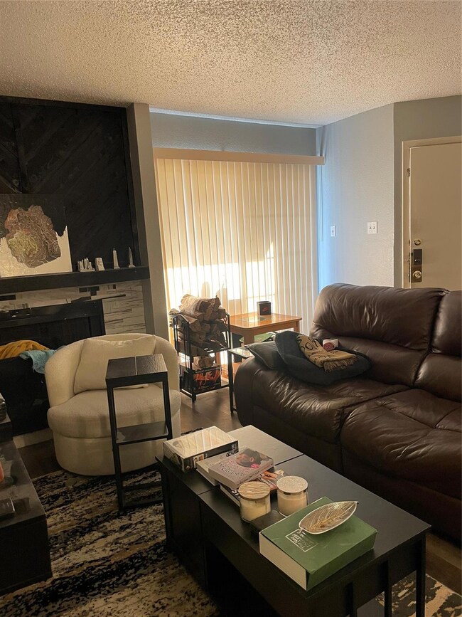 Living area featuring a textured ceiling