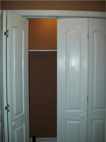  Laundry room with storage shelf.