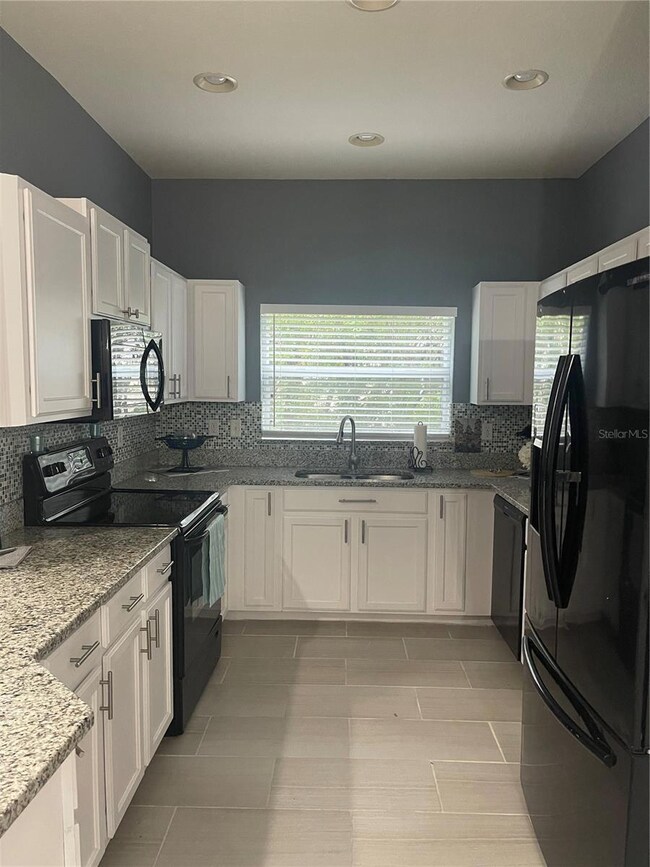 1039 Andrew Aviles Cir, Tampa, FL 33619 - photo 7