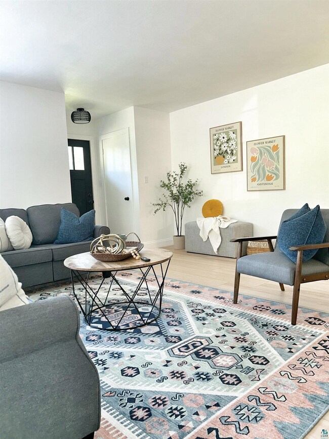 Living room featuring light hardwood / wood-style 