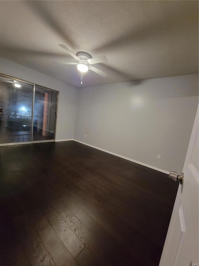 Bedroom View with Sliders to Balcony