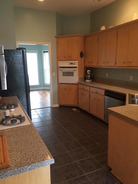 Nice kitchen with tile floors and all appliances to remain!