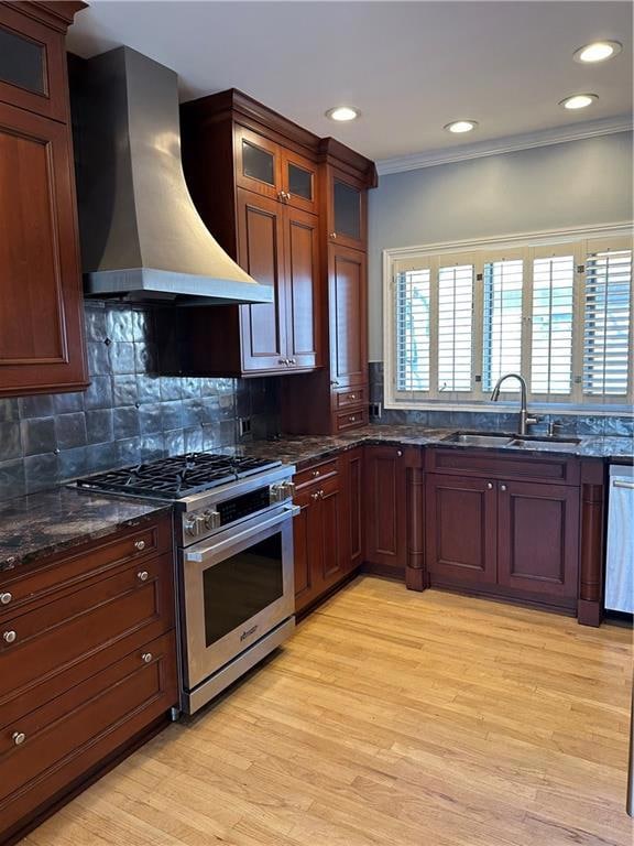 Kitchen featuring ventilation hood, light wood-sty