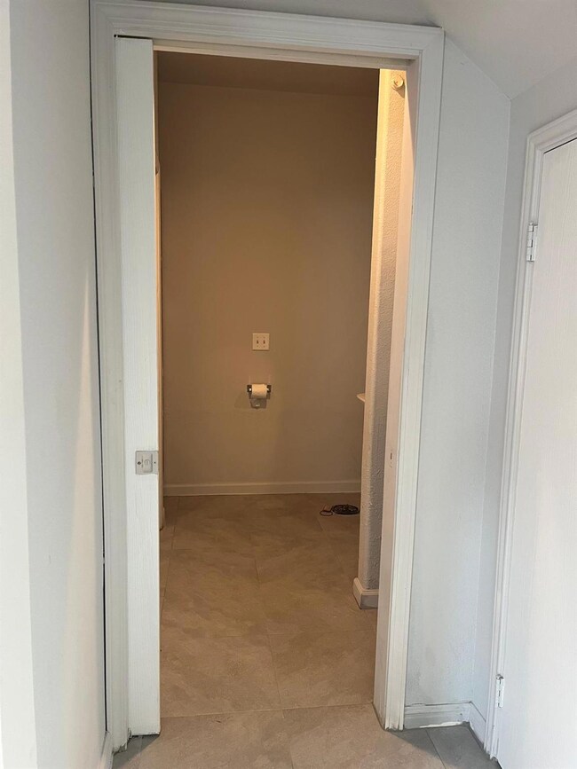 Corridor featuring baseboards