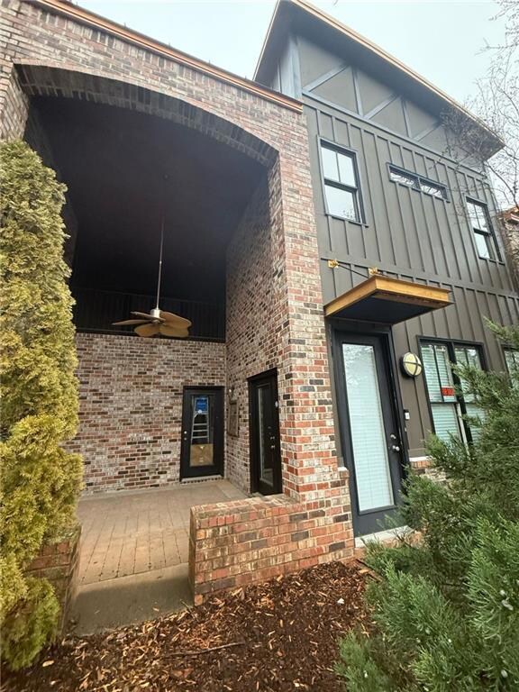Entrance to property with ceiling fan