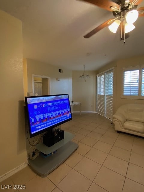 Living area with light tile patterned floors, base