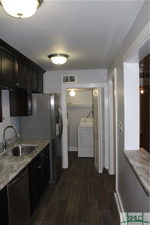 GALLEY KITCHEN WITH ESPRESSO CABINETRY AND MARBLE 