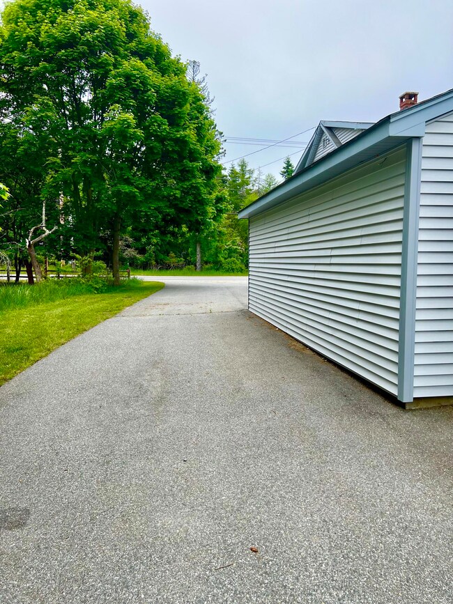 Side showing paved driveway