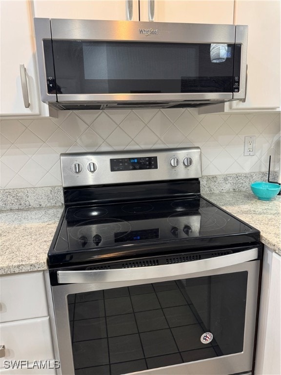 Kitchen featuring stainless steel electric range o