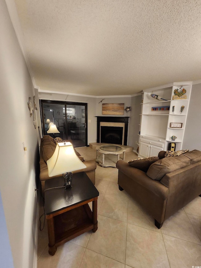 Tiled living room featuring a textured ceiling and