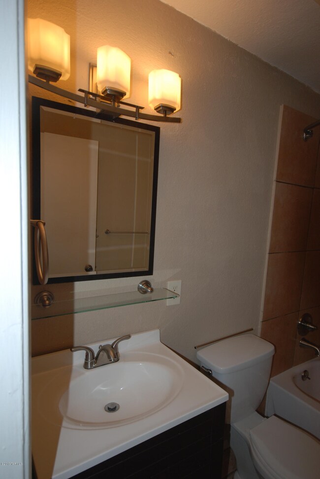 Vanity and New Light Fixture in Bthrm