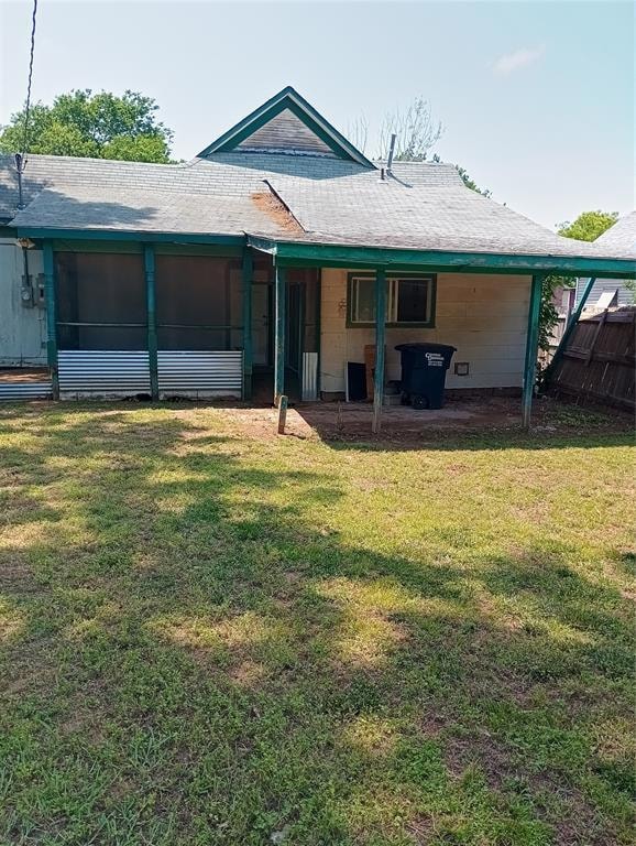 Back of house with roof with shingles