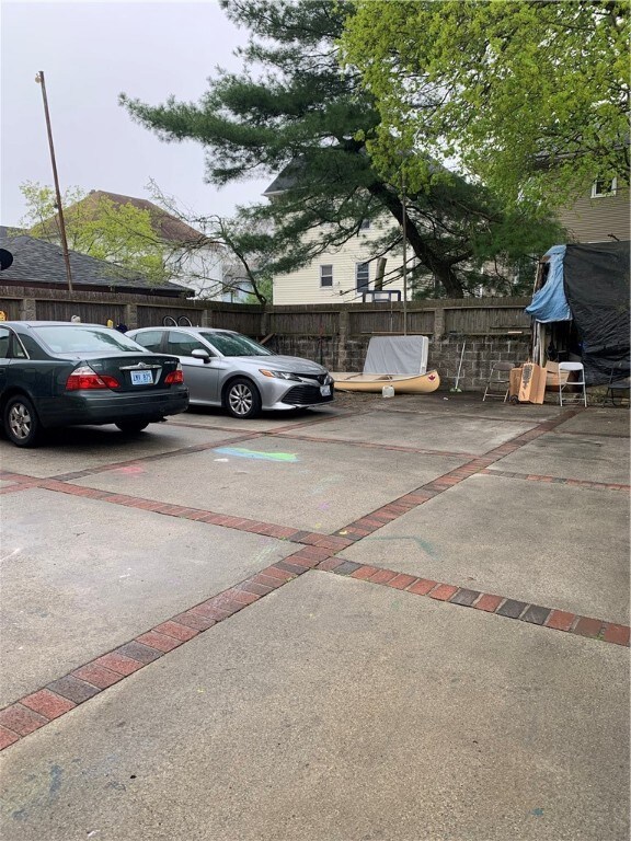 Fenced Backyard and plenty of parking for 6 cars.