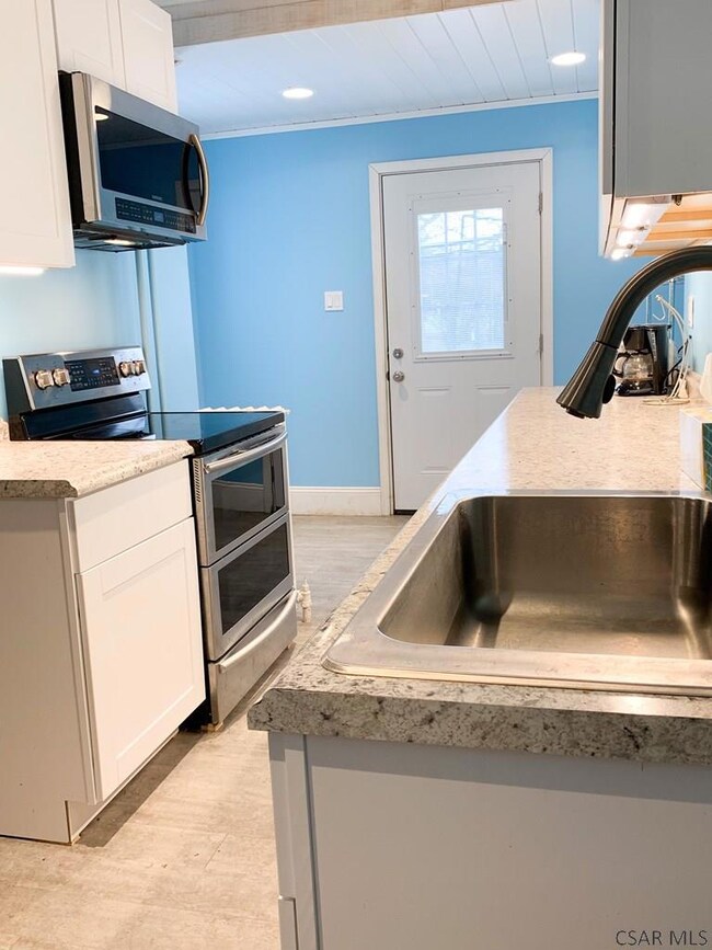 Stainless appliances & room to eat in