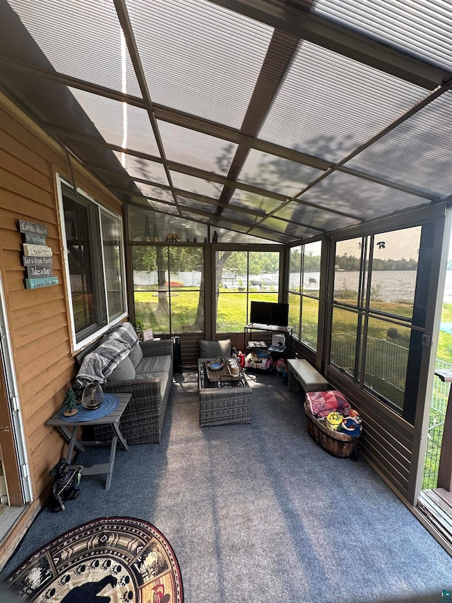 Sunroom with an outdoor living space