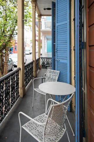 Cozy front porch to watch the neighborhood go by