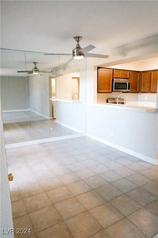 Tiled dining area with ceiling fan