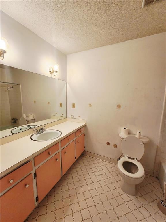 Full bath featuring a textured ceiling, a shower, vanity, tile patterned floors, and a tub