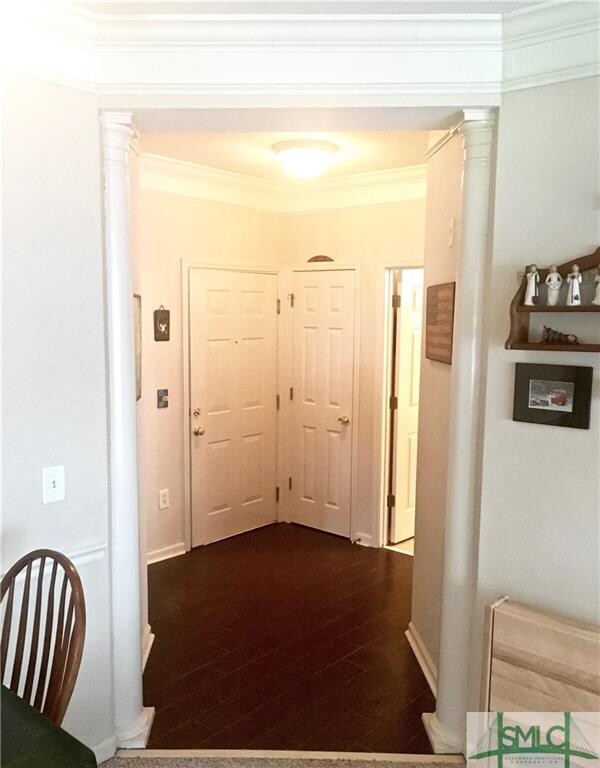 Large entry foyer with custom tile and columns. Gr
