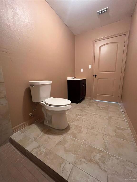 Bathroom with vanity and toilet