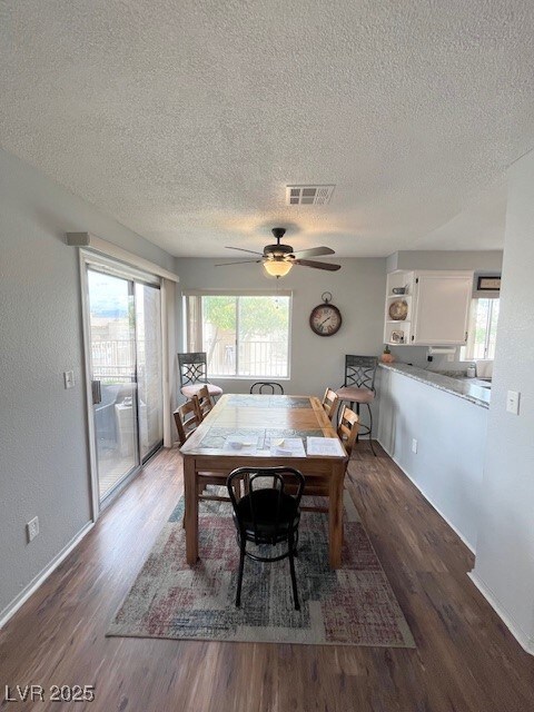 Dining area with plenty of natural light, a textur