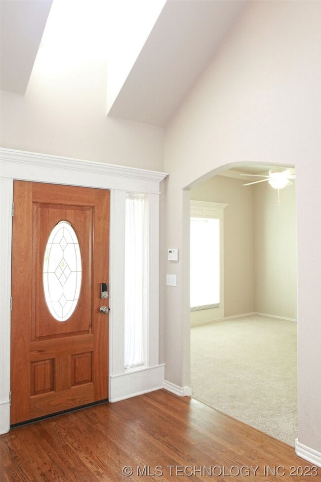 Inside entry offers wood flooring, side windows an