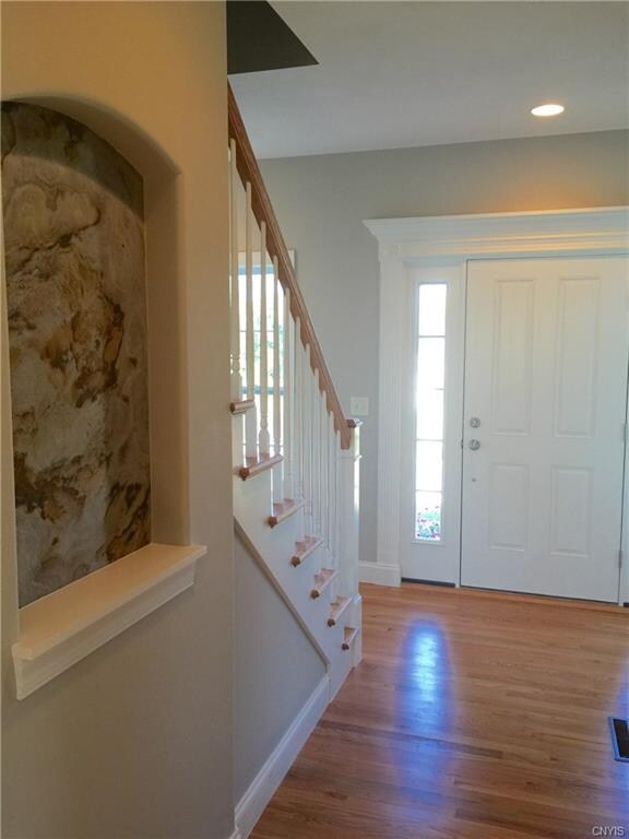 Foyer. Beautiful hardwood floors & faux panted sha