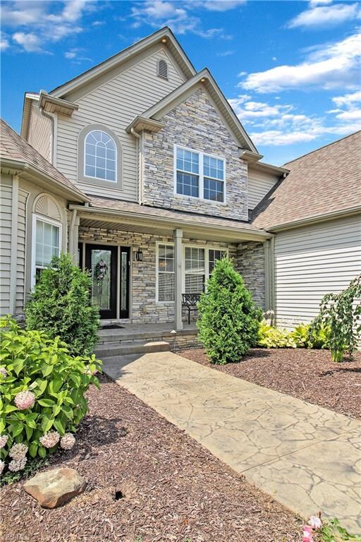 Beautiful Entrance Surrounded by Perennial Gardens