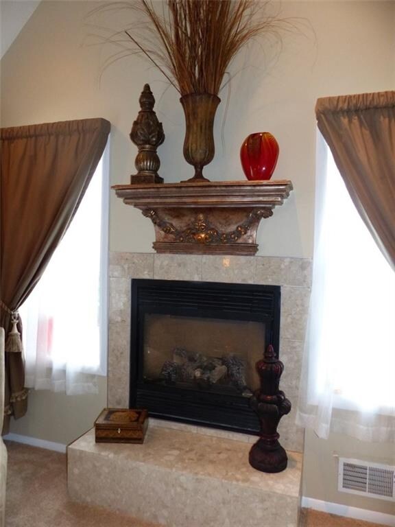 Majestic gas fired, vented fireplace with tile sur