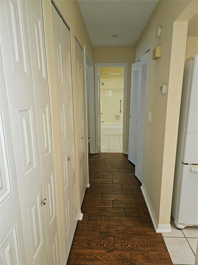 Hall with closets to guest bedroom and bath