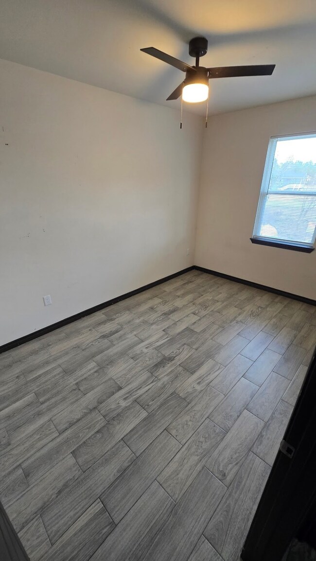 Bedroom 1, no carpet, offering a bright and spacio