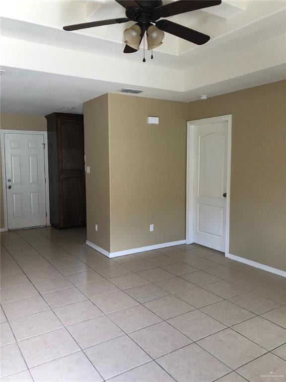 Spare room with light tile patterned floors and ceiling fan