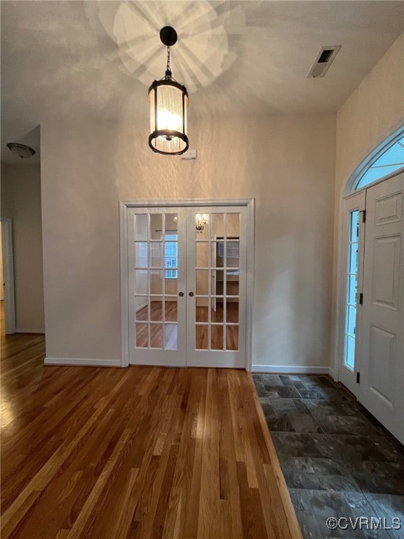 Entryway featuring Slate entrance, French doors to