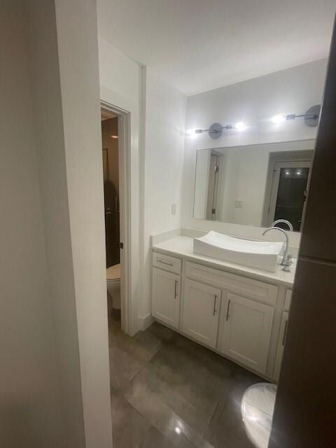 Bathroom featuring toilet and vanity
