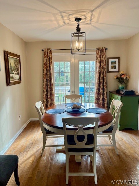 Dining space with a notable chandelier, Glass door