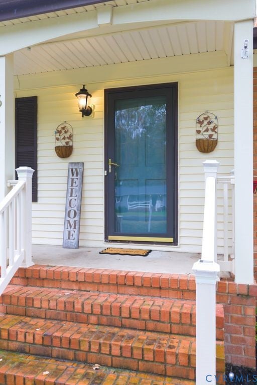 Entrance to property with covered porch