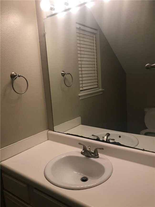 Half bathroom, by downstairs hallway.