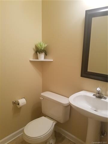 powder room, across from laundry closet, just to l