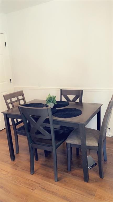 Dining area featuring wood finished floors