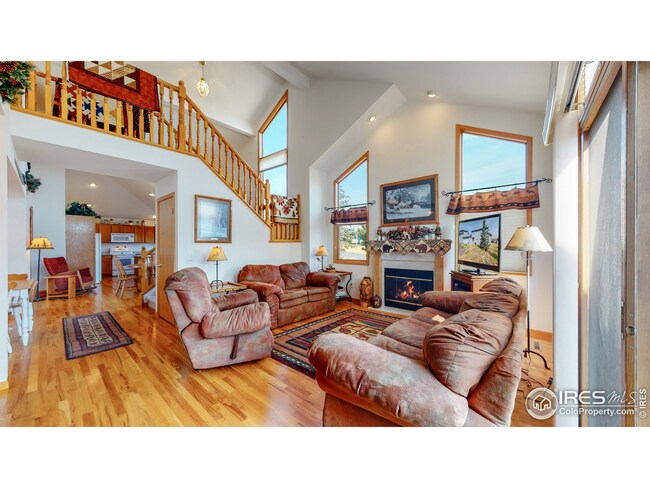 Great room with hardwood floors and fireplace