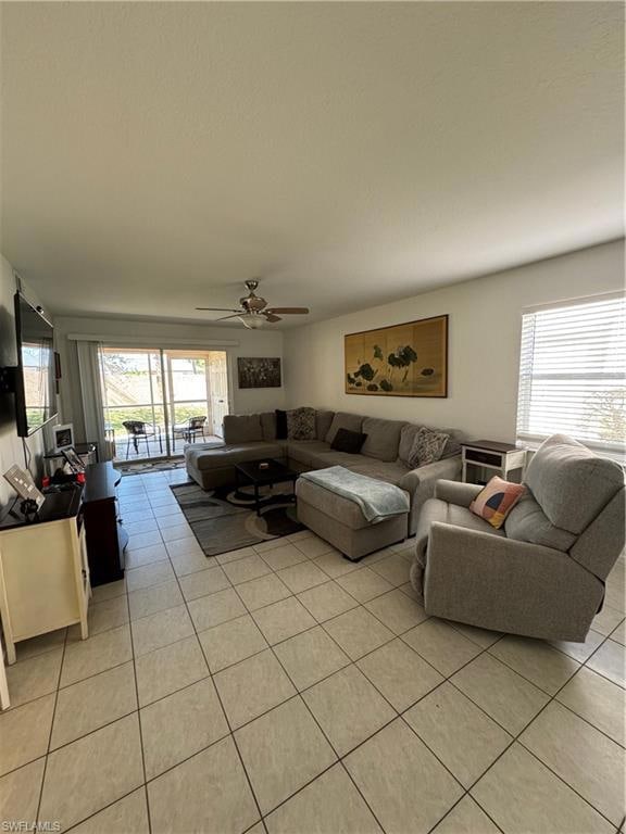 Living area with light tile patterned flooring and