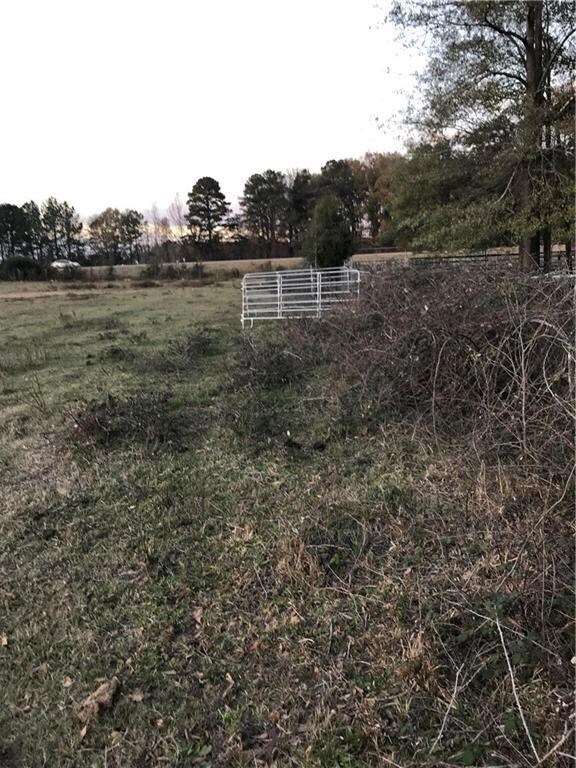 View of yard with a rural view