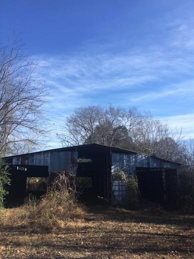 Metal Barn at front of road. There is a 50' easement for neighbor drive and utility, road.