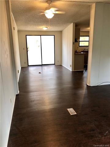Front door facing dining and slider to deck.