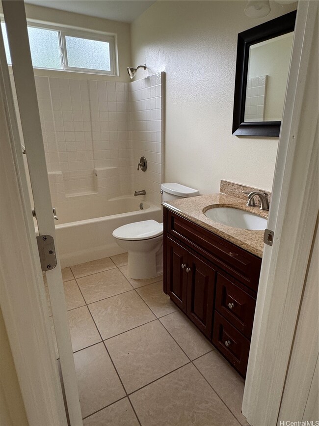 bathroom between 2 bedrooms with granite counterto