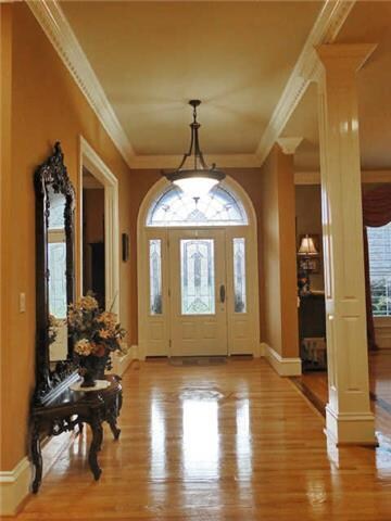 Extensive wood work. Signature medallion consists of 5 different types of wood in foyer. Select grade Oak hardwood flooring throughout the home.