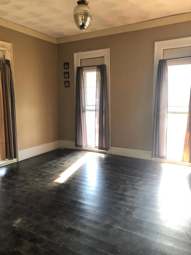 Beautiful living room with tall ceilings, large wi